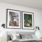 Framed fantasy artwork above bed in modern bedroom.