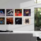 Retro video game posters on modern living room wall.