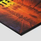 Futuristic orange cityscape artwork on canvas.