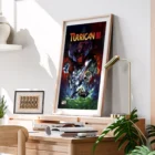 Framed Turrican III poster on wooden desk.