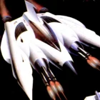 Futuristic spaceship flying through space with engines lit.